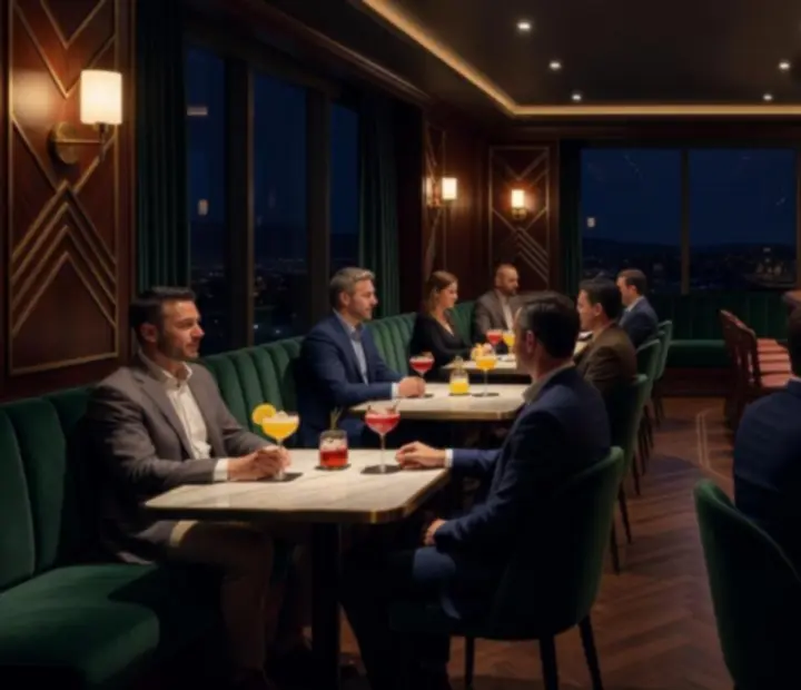 Intimate, dimly lit cocktail bar with emerald tones, brushed copper accents, and guests enjoying drinks at night